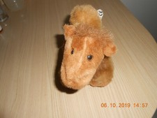 Joli dromadaire en peluche en