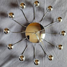 Horloge murale chromée