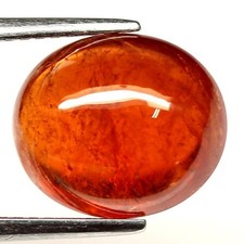 Grenat spessartite orange rouge en cabocon ovale de 2,63Cts