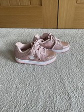 Chaussures à rouleaux roses