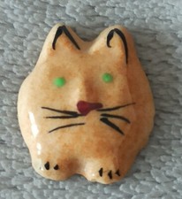 Fève chat en céramique