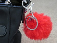 Porte clés Bijou de sac pompon fourrure rouge breloque Aztèques soleil