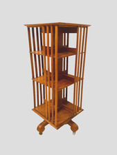 bibliothèque tournante en noyer massif piètements sur roulettes . XIX siècle .