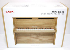Mini piano droit Kawai 1154 pour enfants - instrument de musique naturel 32 t...