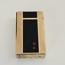 Ancien briquet à gaz Dupont laqué noir/ligne dorée 1L état de fonctionnement
