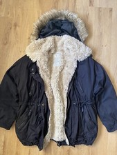 Manteau fausse fourrure noir