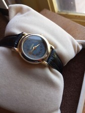 Montre femme quartz Royal dorée cadran bicolore stylé pile incluse