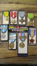 8 médailles + son "placard "