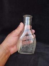 Ancien biberon de bébé à soupape en verre moulé ou soufflé