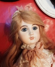 Poupée tête en porcelaine