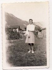 Vintage photo - pretty woman posing in a mountain village