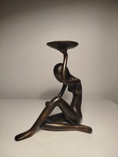 Porte bougie, femme assise en