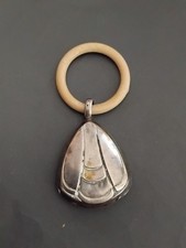 Ancien hochet Art déco en argent massif