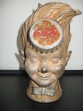 Tirelire publicitaire Sprite Boy de Coca Cola en fonte de fer  XX siècle