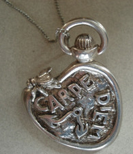 Broche / pendentif surréaliste montre molle d'après Dali argent ?