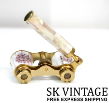 Anciennes jumelles de verres d'opéra vintage blanche nacre et manche laiton