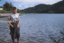 Vintage photo slide 1950s - pretty woman with cats eye glasses by a lake