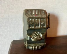 Tirelire ancienne machine à