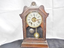 Ancienne pendule réveil mécanique en bois