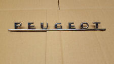 ancien logo Peugeot en acier chromé
