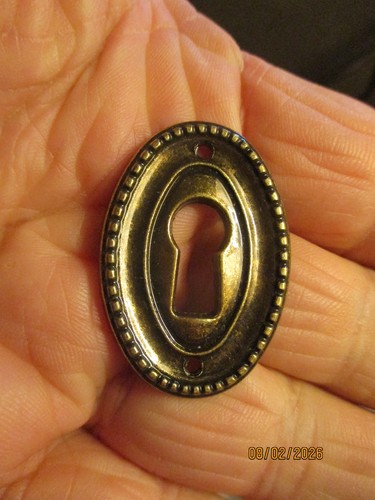 Plaque bronze trou clé - au, à