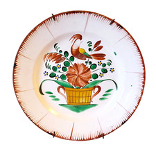 Une assiette les islettes coq et fleurs, XIX ème, 19 ème siècle. Faience.