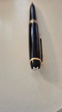 stylo roller MONT BLANC couleur noir avec bague doree état neuf 