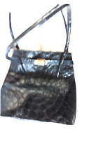 Trés joli sac  en cuir façon croco noir