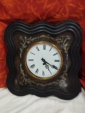 pendule œil de bœuf carrée