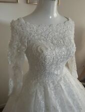 Robe de mariée + voile transparent avec une longue traine taille 36/38