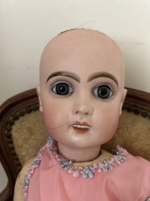 JOLIE TÊTE DE POUPÉE