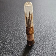 Tube verre contenant 4 tiges de remontoir d'horlogerie pour connaisseur