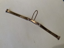 Joli bracelet de montre de femme, en fix doré, vers 1930-1950, chainette sureté