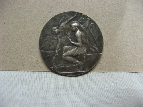 Très belle médaille signée