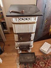 vieux poele en faience blanc à restaurer