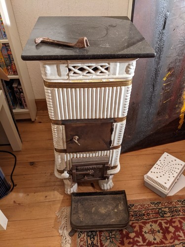 Vieux poele faience blanc - en,