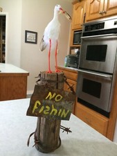 Defiant Egret on fence post