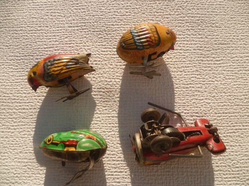 Anciens jouets tôle oiseaux