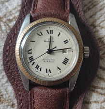 très belle Montre Militaire Marvin Automatique  Swiss  fonctionne parfaitement 