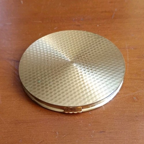Miroir compact doré pour