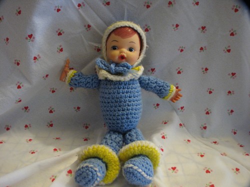 Hand crocheted baby doll - hand,