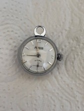 Ancienne montre fonctionnemarque ARGOS  pendentif en forme de  "globe" 