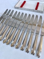 Couteaux en métal argenté -