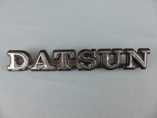 DATSUN sigle monogramme