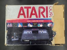 Console Atari 2600 en boite très abimée + Lot de notices VOIR PHOTOS