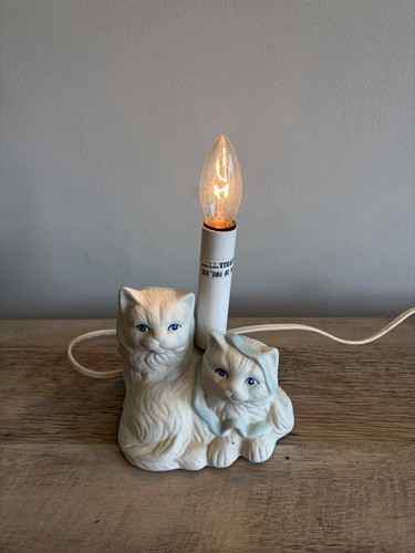 White kittens with - blue, ribbon