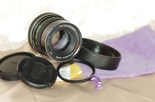 Objectif 85mm f2,8 VOIGTLANDER avec bouchon, filtre, 2 pare-soleils, housse TBE