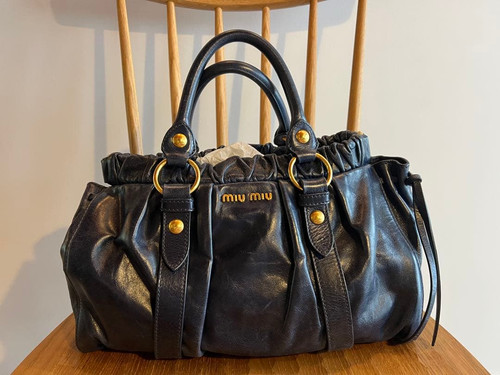 Sac main miu - à,