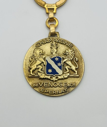 Porte clé champagne de - -,