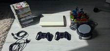 PS3  Sony super slim blanche avec 2 manettes et 16 jeux 